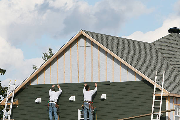 Professional Storm Damage Siding Repair technician working in Union City, TN